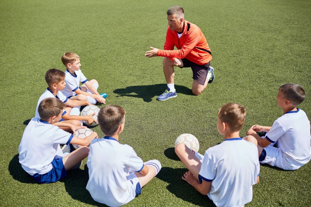 Coach Talking to Junior Football Team